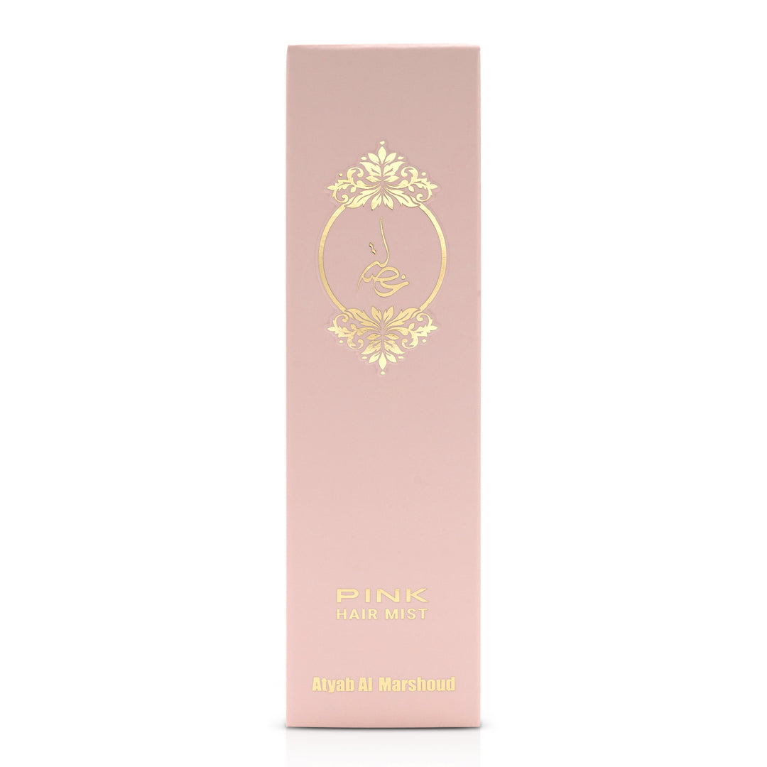 Front view of the pink body essence product box with gold floral detailing.