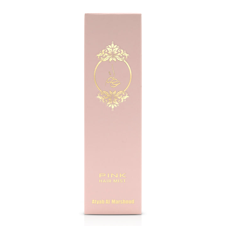 Front view of the pink body essence product box with gold floral detailing.
