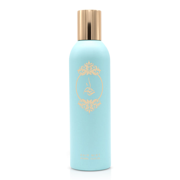 Light blue body essence bottle with gold printed emblem and gold cap displayed on a white background.