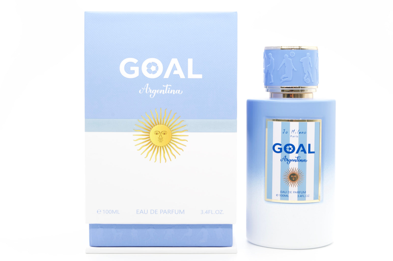 Goal Argentina Eau de Parfum bottle and its packaging box, featuring a light blue and white design with a yellow sun emblem, set against a white background with silver studio reflectors visible on the sides.